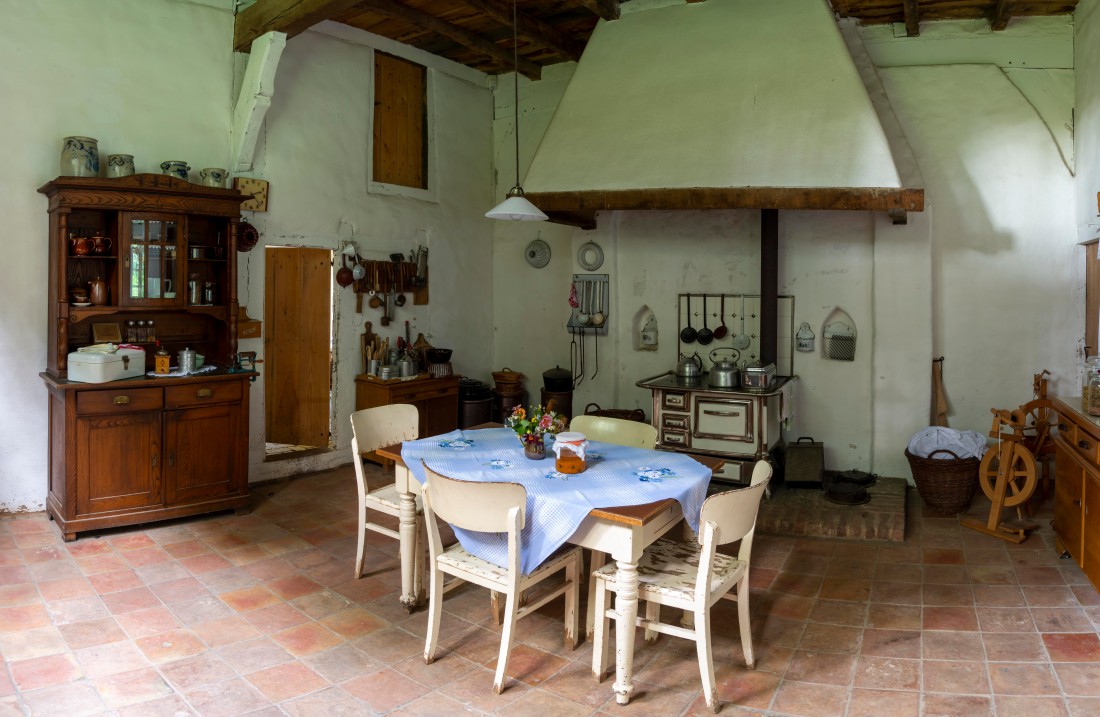 Farmhouse kitchen with stove, table and chairs