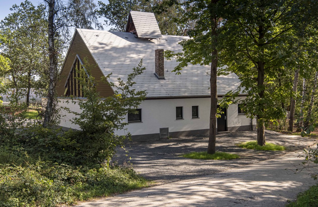 A path leads to a white chapel