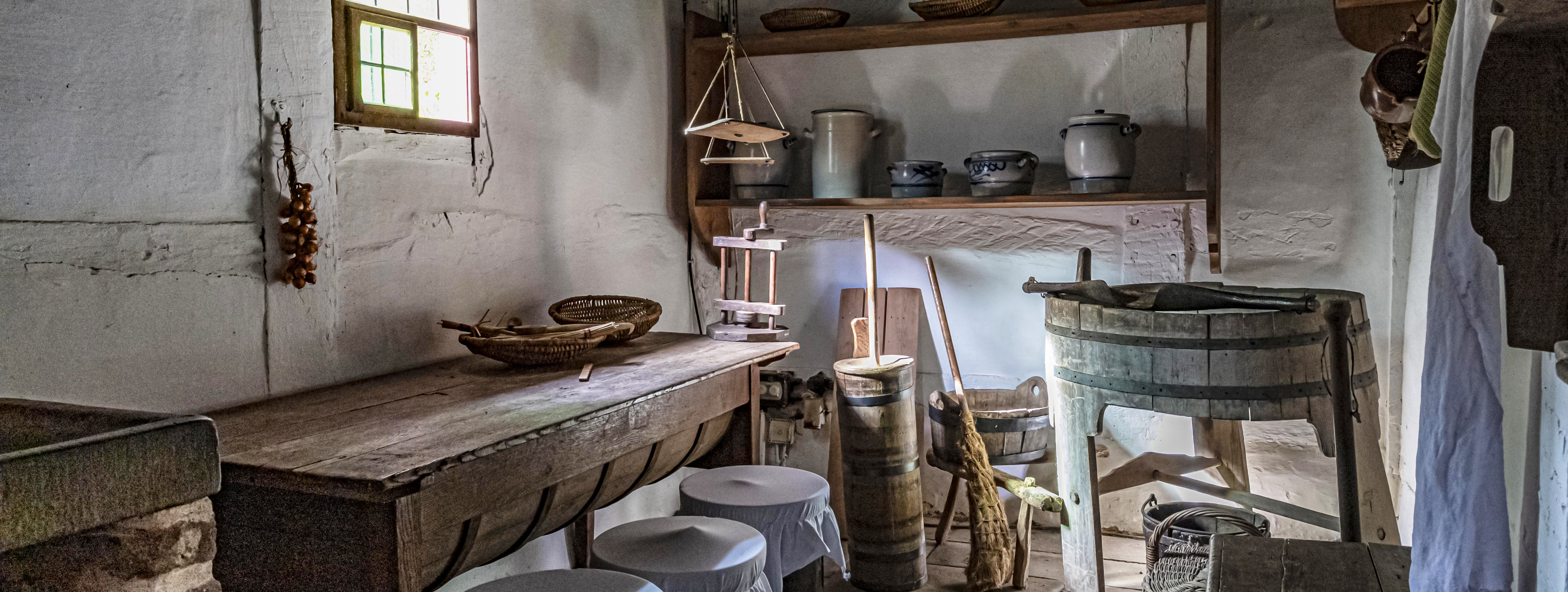 Chamber with a table and wooden cleaning objects