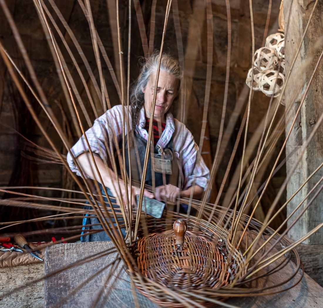 Basket fencer working on a chair base